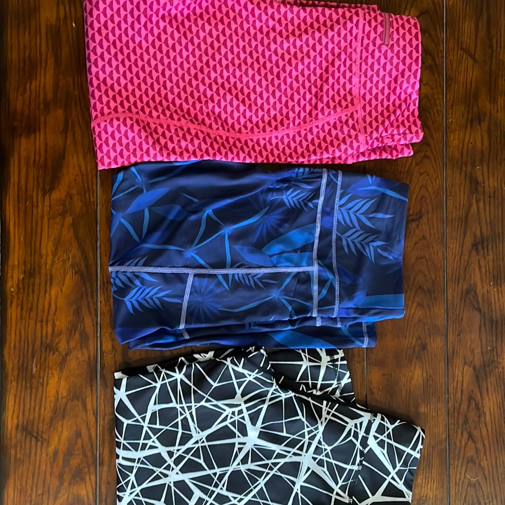 Lot of 3 leggings. Pink are Vineyard Vine - blue are Zyia. Black no tags.